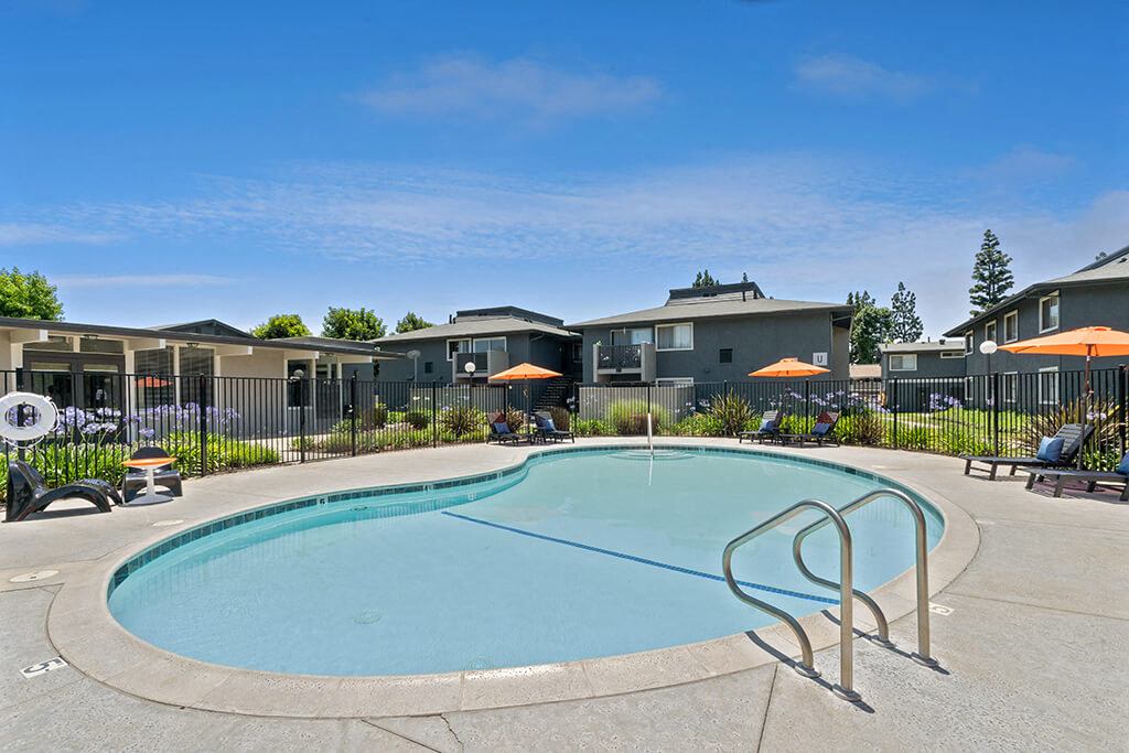 The large community pool on a sunny day at Westchester Park Apartments in Tustin, California.